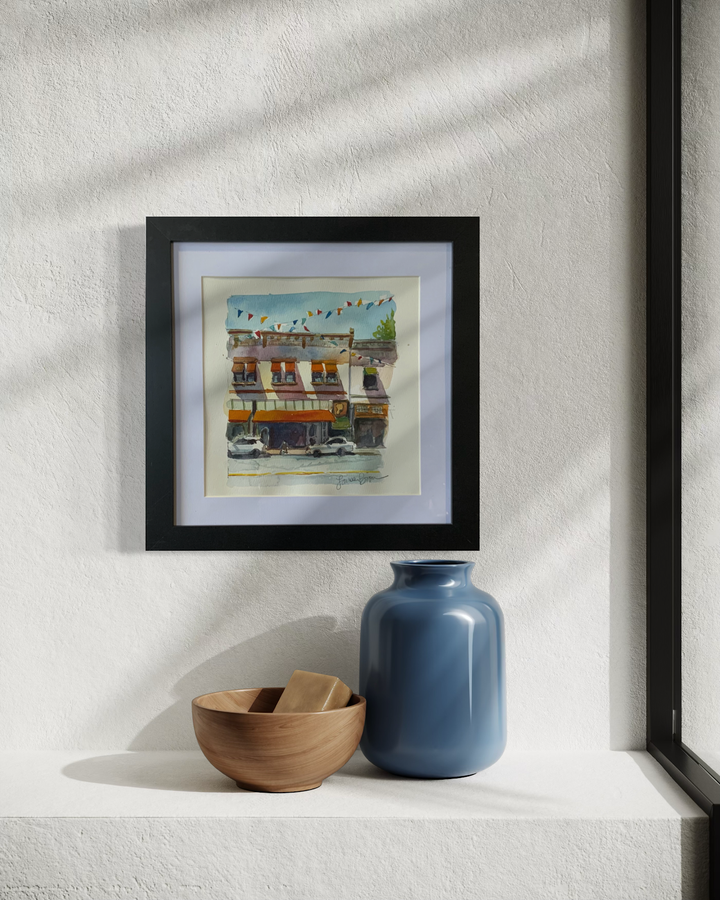Orange Circle Glassell Flags, framed and styled on a wall